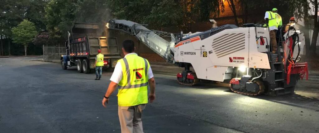 PKS Paving employees and an asphalt milling machine